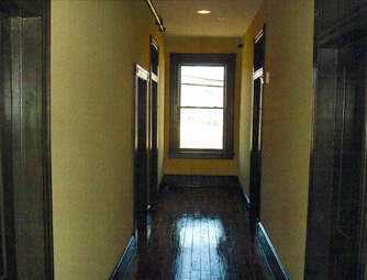 An unprotected window (glass) facing the corridor of transom doors