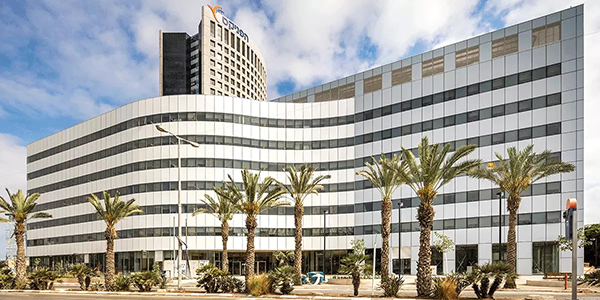 exterior of building's photovoltaic façade composed of crystalline silicon glass with white digital printing on the surface