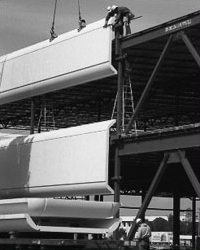 Photo of construction site erecting precast concrete panels with push-pull connections