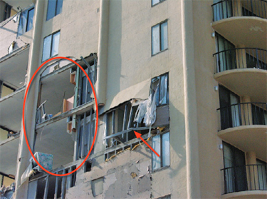 Photo of a building where the wall framing was inadequately attached to the structure