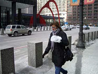 street scene with square bollards to separate sidewalk from roadway