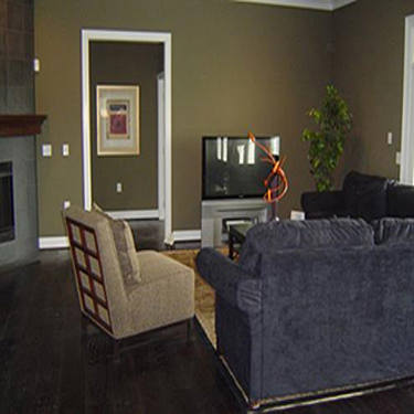 living room with a wide open doorway leading into a hallway