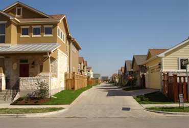 an alley way between homes with a zero-step entrance through the garage